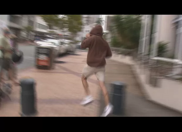 Driver flees cameras by jumping down stairs