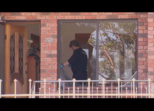 Family fleeing to safety before man assaulted their home in Sydney.