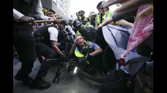 Police arrest 50+ at Chicago protest with large law enforcement presence.