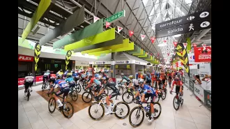 Spanish cycling race begins from inside a supermarket, a unique and unexpected start for the event.