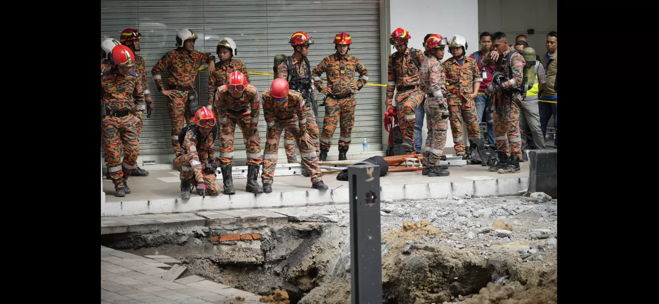 Malaysian woman falls into 8m-deep hole when pavement collapses.