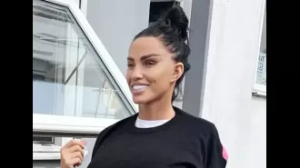 Katie Price proudly displays her fully healed and expensive new face with a big smile.