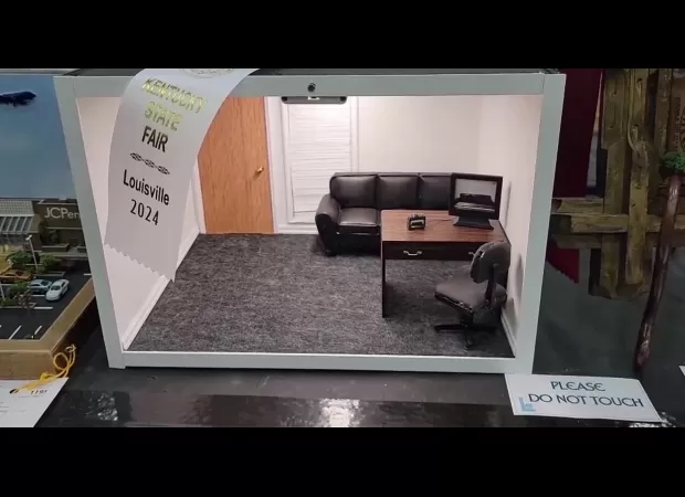 Contest winner disqualified for creating a miniature of a porn set, discovered by judges.