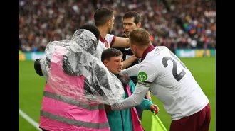 West Ham players save ball boy after supporters fall from stands while cheering.