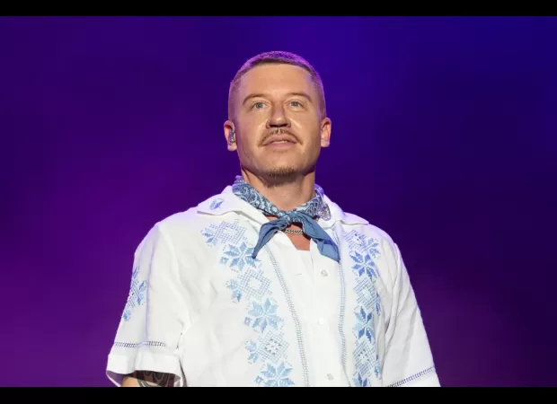 Macklemore cancels concert in Dubai due to dire humanitarian situation in Sudan.