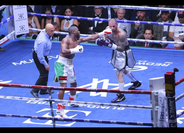 Floyd Mayweather Jr causes chaos by getting referee kicked out during boxing match.