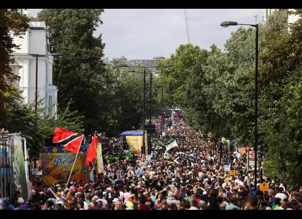 The streets of London are filled with bright hues as a million people gather for the Notting Hill Carnival.