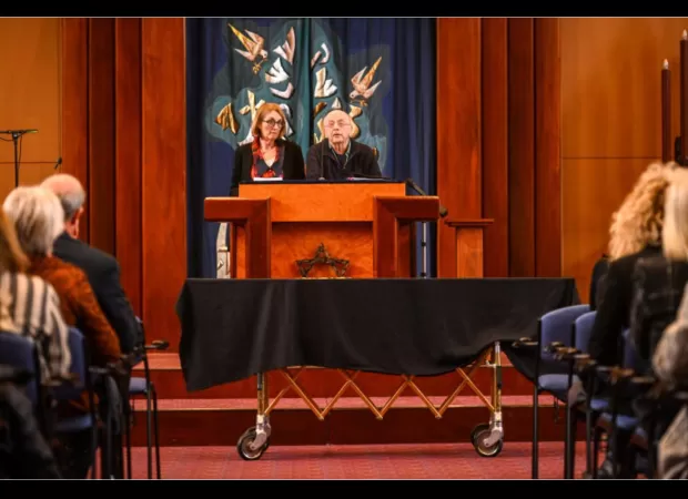 Hundreds gather to bid emotional farewell to beloved sports journalist during moving service.