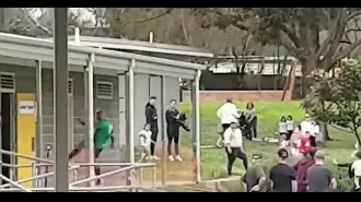 A soccer player's unexpected behavior during a game as they chase and kick a door in pursuit of a referee.