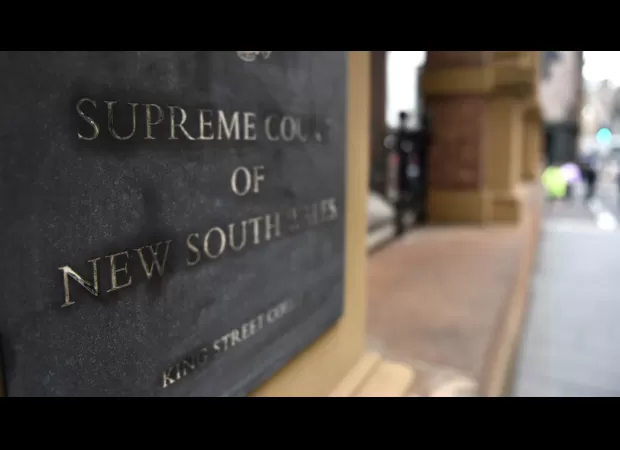 A Sydney shop owner has been found guilty of intimidating a jury member in a significant court case involving vintage goods.