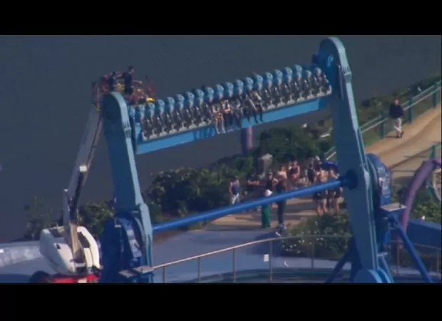 People stuck in the air due to ride malfunction.