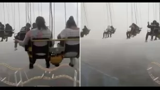 Storm causes ride to stop, trapping people 200ft in air.
