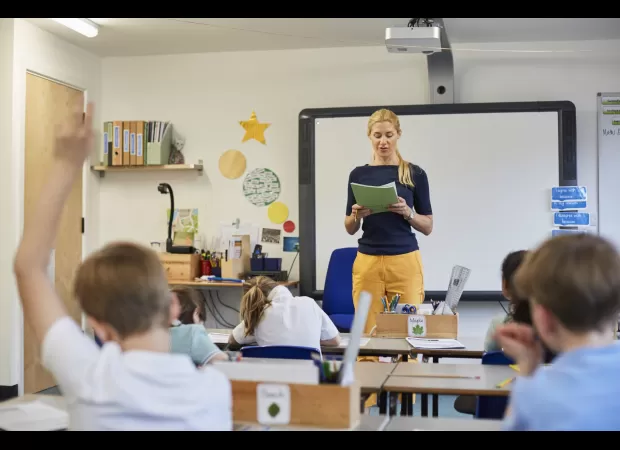 AI assists teachers in grading assignments.