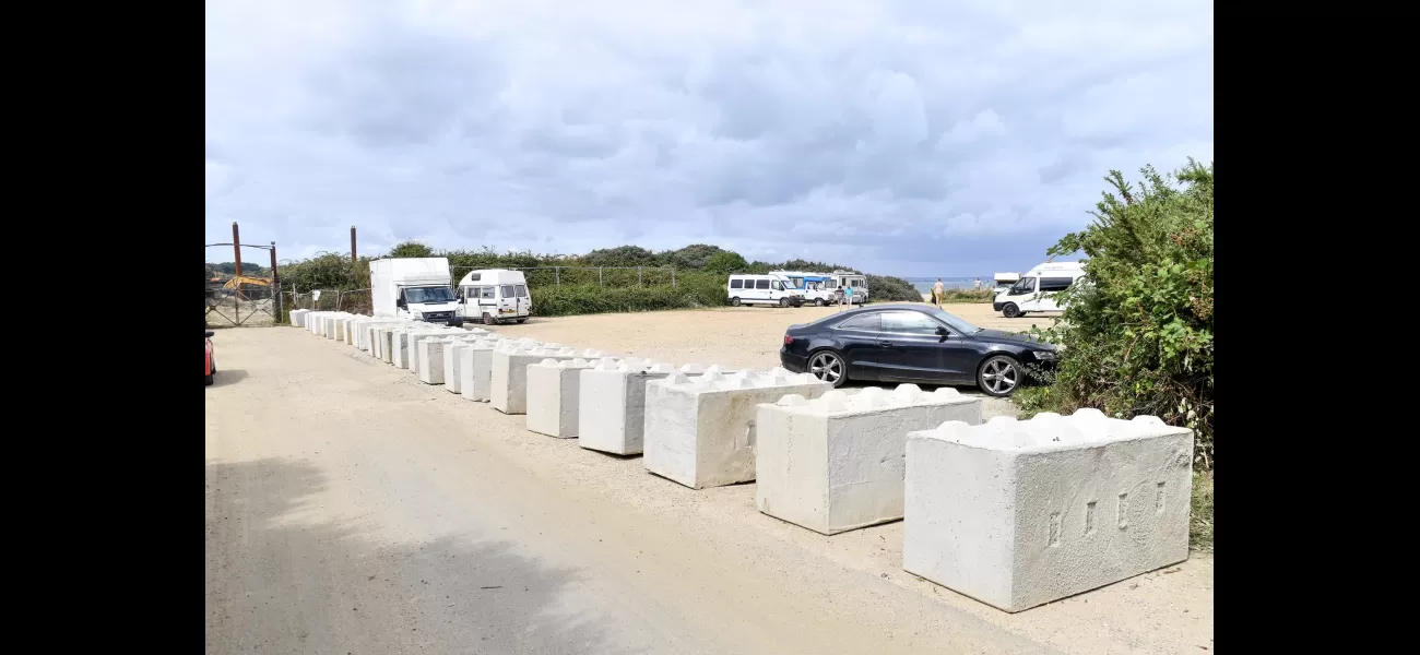 Controversy over parking in coastal town as owner puts up concrete barriers.