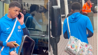 A Chelsea player denies accusation of pretending to be on a phone call in order to avoid fans.