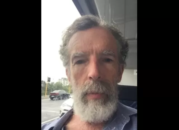 A man has been taken into custody in connection with the killing of a well-known bug specialist from New Zealand.