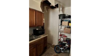 Suspect falls through ceiling during home search by marshals after murder accusation.