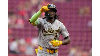 TJ Friedl leads Reds to victory over A's, despite Lawrence Butler's three home runs.