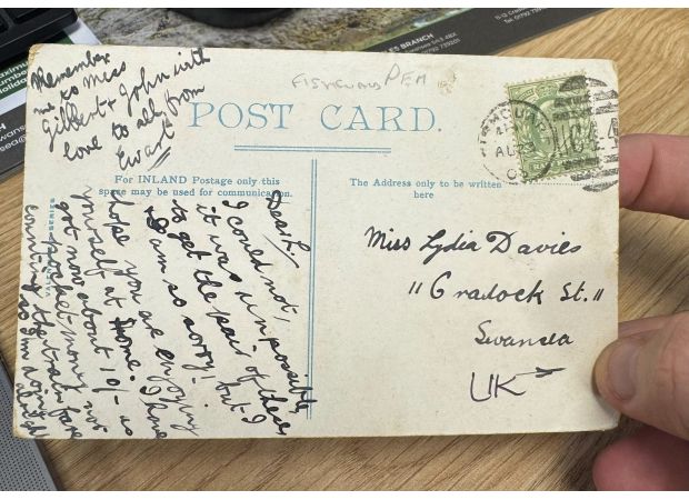 A postcard that was 121 years overdue has finally been delivered.