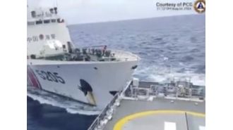 Chinese and Philippine ships crash at disputed island.