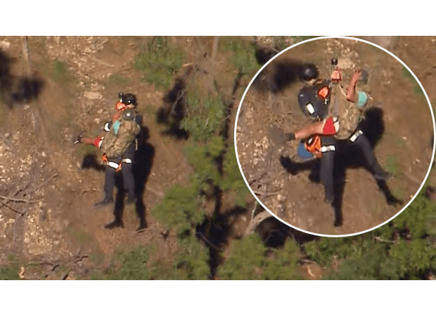 Rescue mission underway for four hikers stranded on cliff overnight.