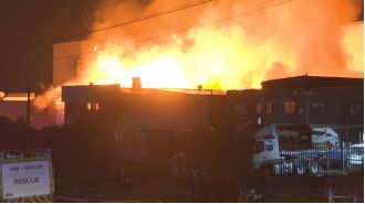 Firefighters struggling to contain factory fire in Sydney's western region.