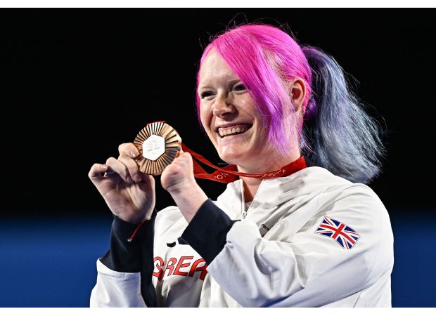 Pregnant Paralympian wins bronze while still seven months along, despite challenges from her baby.