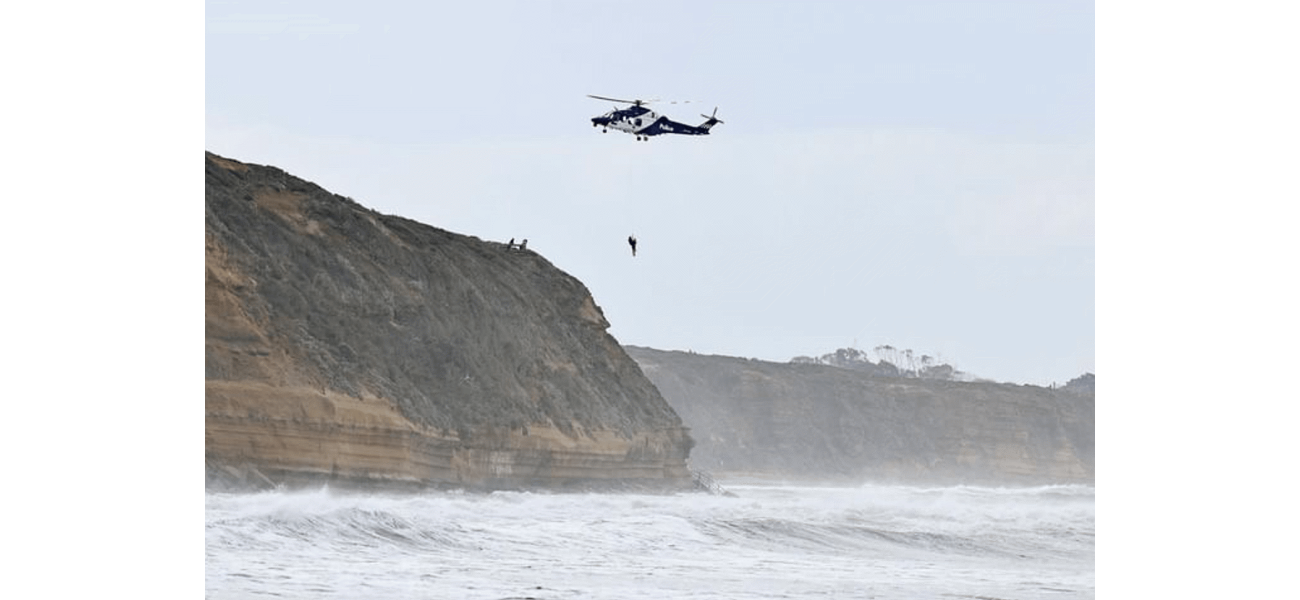 A surfer was dramatically rescued by a helicopter and the moment was captured on video.