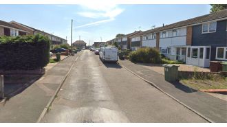 Young man arrested in connection with death of elderly woman, who was discovered with knife wounds.