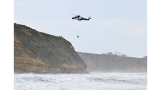 A surfer was dramatically rescued by a helicopter and the moment was captured on video.