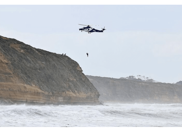 A surfer was dramatically rescued by a helicopter and the moment was captured on video.