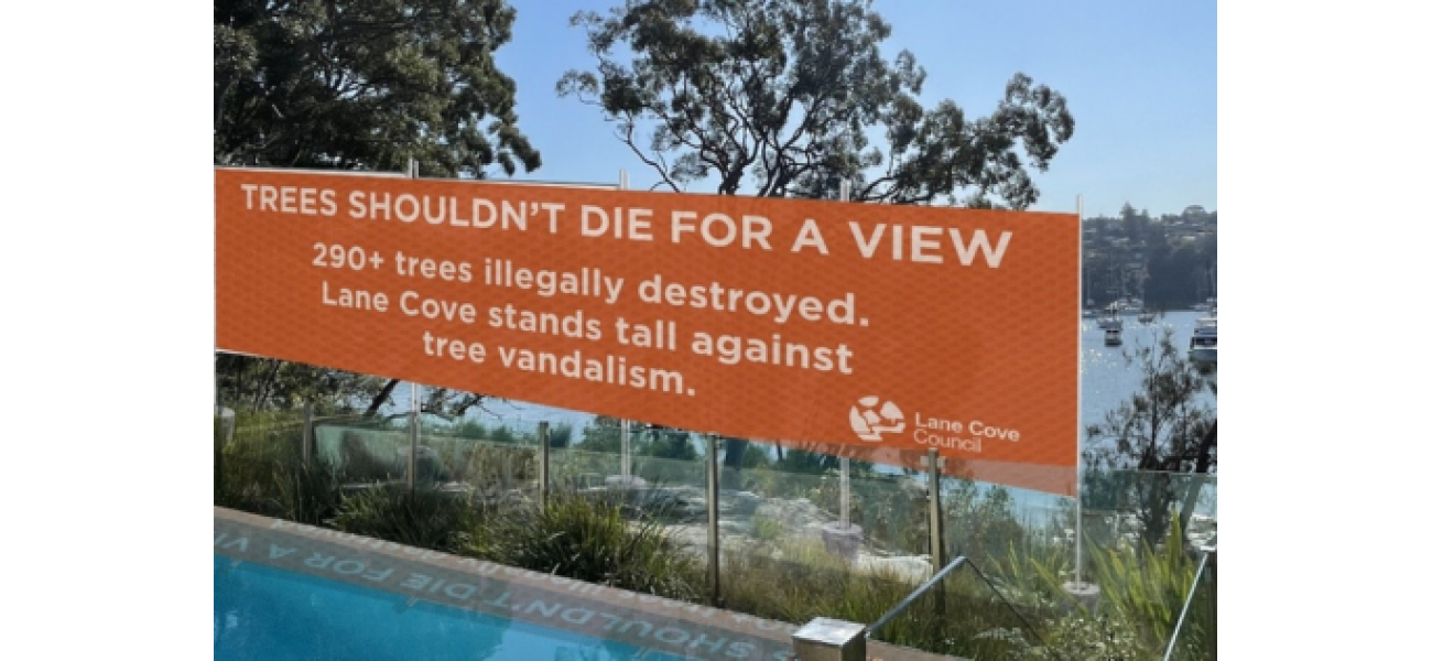 Sydney construction starts on banner after 'tree vandalism,' blocking views.