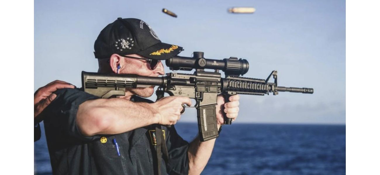 Navy dismisses commander for photo of rifle with wrong scope orientation.