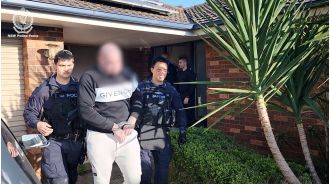 A suspected member of a motorcycle gang has been arrested for attacking and stomping on a man in Sydney.