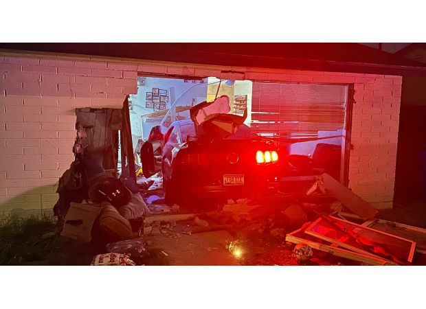 Couple's dinner interrupted when car crashes through living room