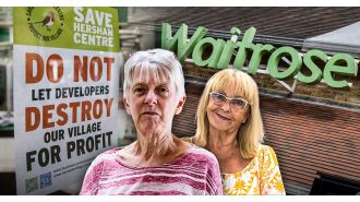 Angry villagers protest £6 million development, worried about potential closure of Waitrose.