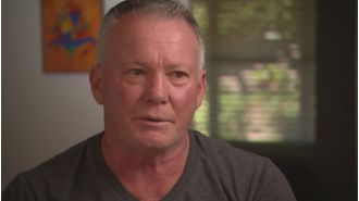 Grandfather praised for stopping stabbing during car accident.
