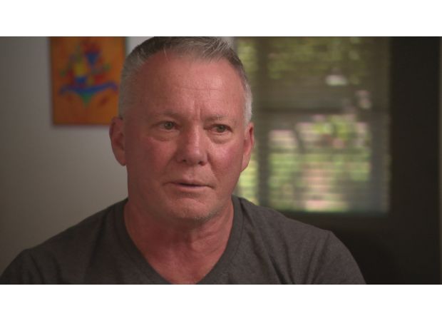 Grandfather praised for stopping stabbing during car accident.