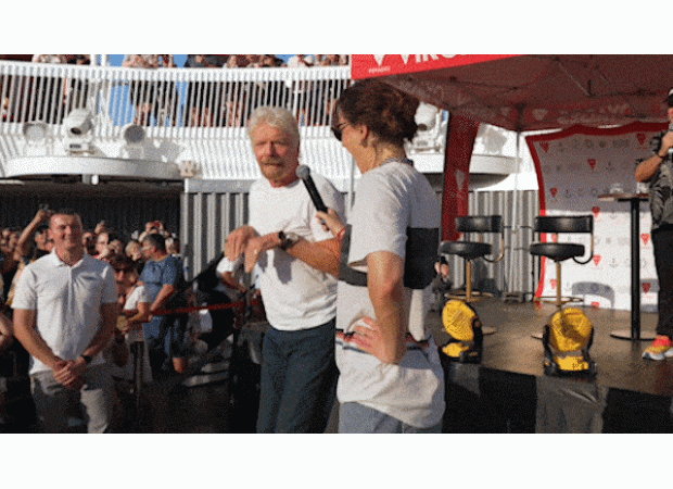 Raygun teaches Branson breakdancing on Virgin cruise.