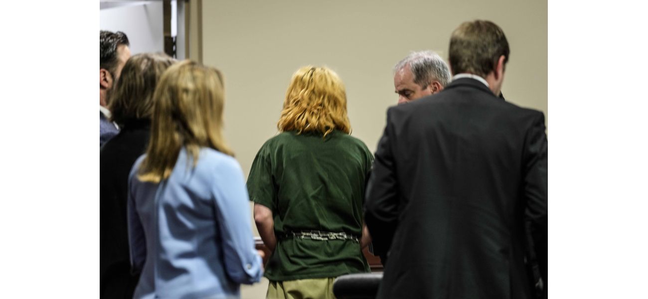 A teenager arrested for a school shooting in Georgia and his father are seen in court for the first time.