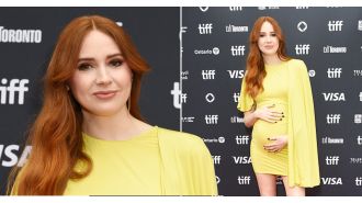 Karen Gillan reveals she's pregnant while attending movie premiere after extended absence.