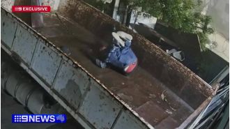 Security footage captures suspected trespasser falling off roof in front of unaware cops.