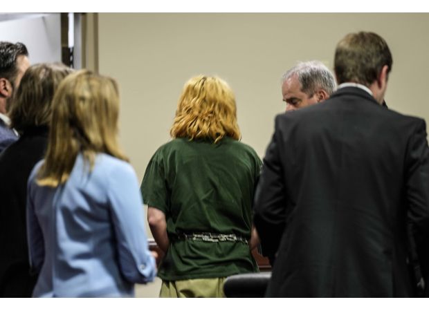 A teenager arrested for a school shooting in Georgia and his father are seen in court for the first time.