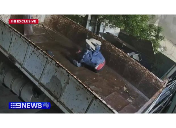 Security footage captures suspected trespasser falling off roof in front of unaware cops.