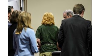 A teenager and his father accused of a school shooting in Georgia face their first court hearing.