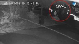 Startling footage captures a man being shot in the driveway of a home in Queensland.