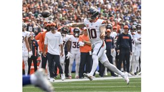 In the first game of the NFL season, the Denver Broncos lost 26-20 to the Seattle Seahawks. Photos show the action.