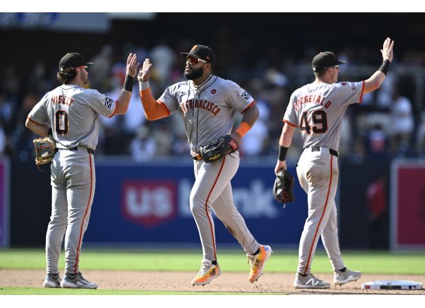 Tensions between SF Giants' rookie infielders overshadow victory against playoff-hopeful Padres.