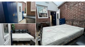 Conservatory bed advertised as 'studio flat' for £1,200/month.