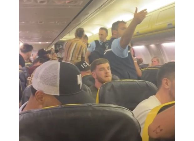 Disorderly behavior on Ryanair flight as British couple assaults crew and spits at other passengers.
